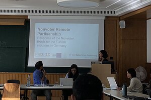 Photo of Öykü presenting research.