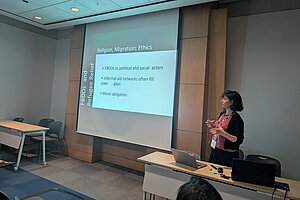 Öykü presenting research in Seoul.