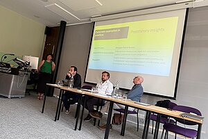 Öykü presenting research in London.